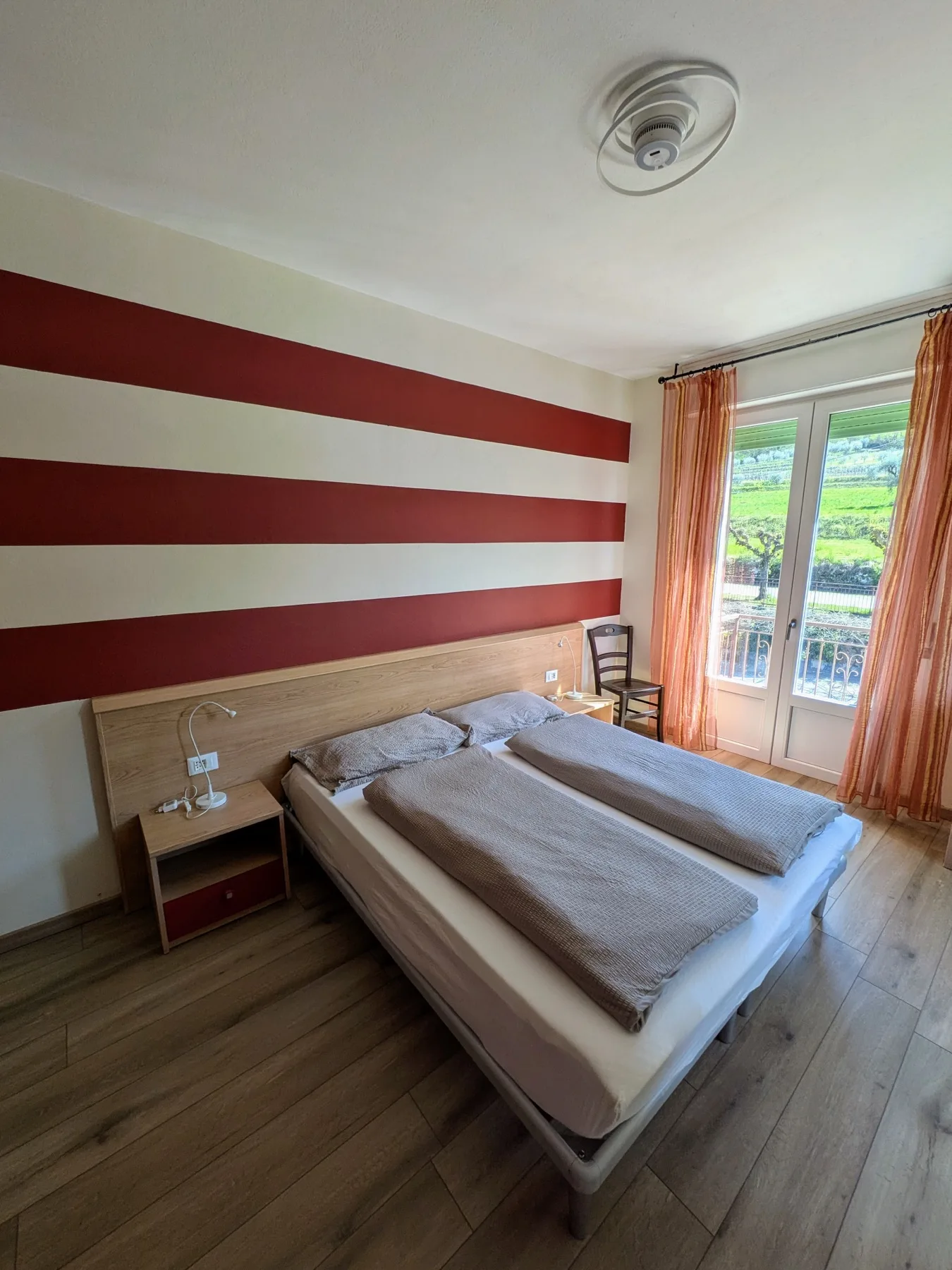 Double bed with private balcony facing the greenery